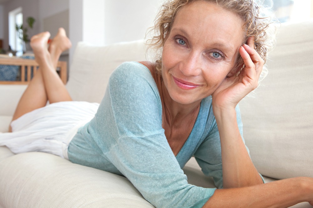 Portrait Of Adult Beautiful Mature Woman With Charming Makeup Lying